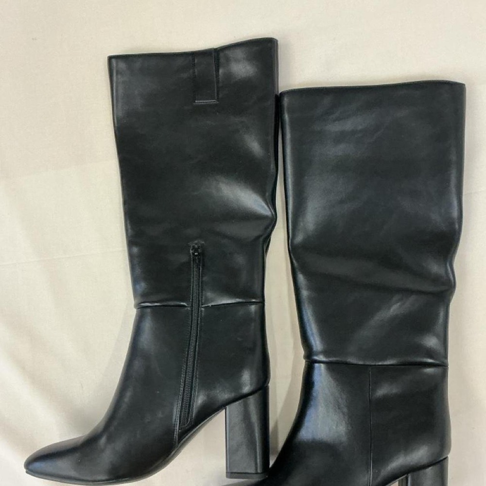 Black knee-high boots by A‎ New Day featuring a sleek faux leather finish